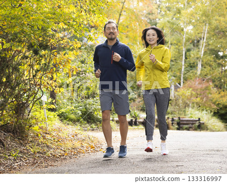 A middle-aged couple running A middle-aged couple running 133316997