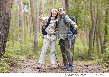 A middle-aged couple hiking 133317583