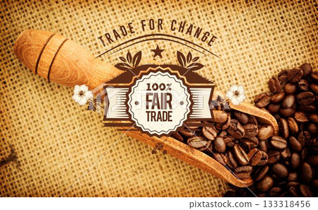 Wooden scoop is holding coffee beans and fair trade emblem in flat design on burlap fabric 133318456
