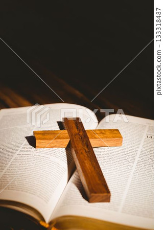 Wooden cross on bible book 133318487