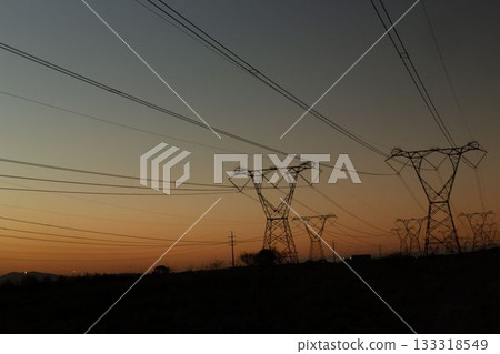 The evening electricity pylon silhouette The evening electricity pylon silhouette 133318549