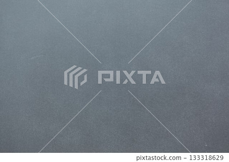 Grey textured surface is filling flat design frame while showing subtle grainy details 133318629