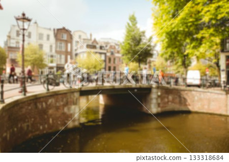Pedestrians and cyclists are crossing arch bridge over calm canal in flat design with parked bikes Pedestrians and cyclists are crossing arch bridge over calm canal in flat design with parked bikes 133318684