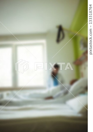 Doctor taking care of patient in hospital room Doctor taking care of patient in hospital room 133318764