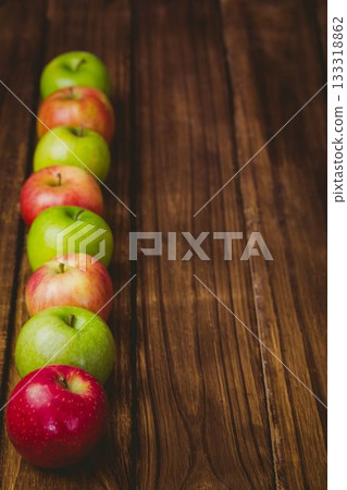 Red and green apples on table 133318862