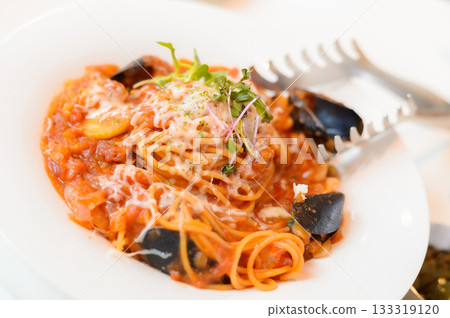 Delicious Seafood Tomato Pasta with Mussels and Melted Cheese Delicious Seafood Tomato Pasta with Mussels and Melted Cheese 133319120