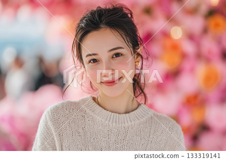 Portrait of a smiling woman surrounded by spring flowers 133319141