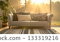Sofa and cushions in the living room bathed in morning sunlight 133319216