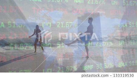 Laughing couple in sports bra and board shorts splashing waves at beach with ticker overlay Laughing couple in sports bra and board shorts splashing waves at beach with ticker overlay 133319530