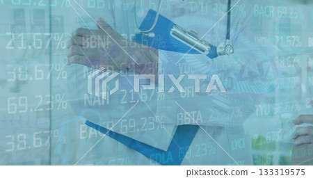 Female doctor in lab coat holding clipboard and stethoscope in clinic, displaying data overlay 133319575