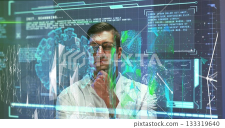 Analyzing data scientist in lab coat standing before panels in lab, with holographic world map Analyzing data scientist in lab coat standing before panels in lab, with holographic world map 133319640