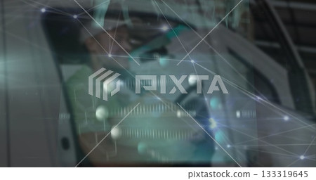 Inspecting technician wearing respirator leaning on frame at lab with network overlay, copy space Inspecting technician wearing respirator leaning on frame at lab with network overlay, copy space 133319645