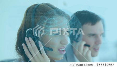 Call center agent wearing shirt and headset handling customer call in office with globe overlay 133319662