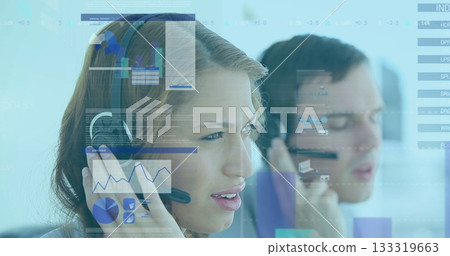 Adjusting earpiece call center agent monitoring graphs at desk, headset, digital graphs, copy space 133319663