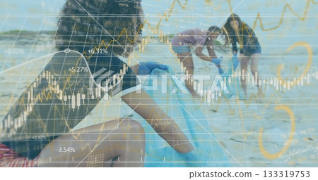 Collecting woman wearing blue gloves moving litter into blue trash bags on beach with stock charts 133319753