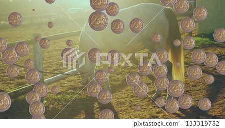 Grazing white horse munching on grass in paddock fenced with rails, with floating two-cent coins Grazing white horse munching on grass in paddock fenced with rails, with floating two-cent coins 133319782