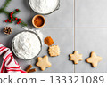 Christmas Baking Ingredients and Holiday Cookies on Kitchen Table 133321089