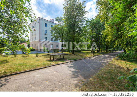 Peaceful Residential Area with Green Trees and Apartment Building Peaceful Residential Area with Green Trees and Apartment Building 133321236