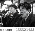 Black and white photo of a businessman drinking at an izakaya after work 133321488