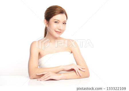 A beautiful young Asian woman with clean, fresh skin against a white background. Skincare, facial treatment, cosmetology, beauty, and spa. An elegant portrait of an Asian woman. A beautiful young Asian woman with clean, fresh skin against a white background. Skincare, facial treatment, cosmetology, beauty, and spa. An elegant portrait of an Asian woman. 133322109