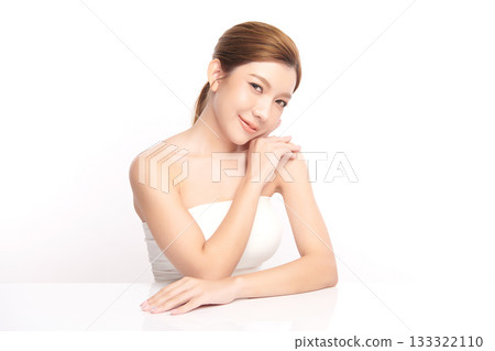 A beautiful young Asian woman with clean, fresh skin against a white background. Skincare, facial treatment, cosmetology, beauty, and spa. An elegant portrait of an Asian woman. A beautiful young Asian woman with clean, fresh skin against a white background. Skincare, facial treatment, cosmetology, beauty, and spa. An elegant portrait of an Asian woman. 133322110