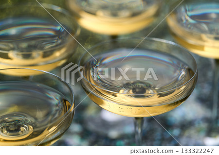 champagne wine in a coupe glasses ready to drink, close up. champagne wine in a coupe glasses ready to drink, close up. 133322247