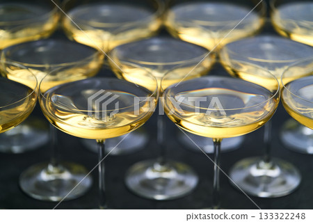 champagne wine in a coupe glasses ready to drink, close up. champagne wine in a coupe glasses ready to drink, close up. 133322248