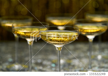 Bubbly champagne wine in a coupe glasses ready to drink, selective focus. 133322249