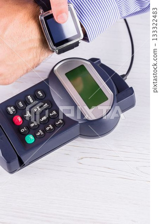 Man using smart watch to express pay Man using smart watch to express pay 133322483