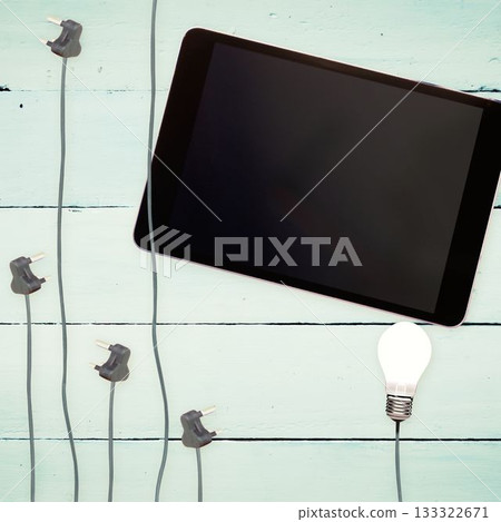 Bulbs and tablet on wooden background Bulbs and tablet on wooden background 133322671