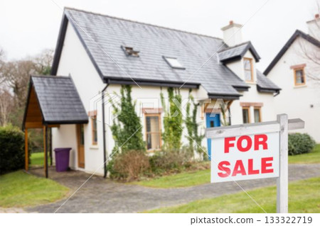 For sale signboard by residential building 133322719