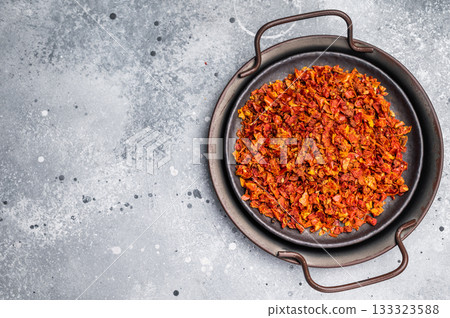 Dried Tomato Flakes, Indian and Arabic spices for cooking. grey background. top view 133323588