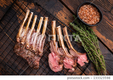 Grilled Rack of lamb, mutton meat chop steaks with thyme. wooden background. top view 133323598