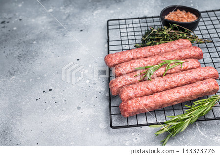 Raw beef and lamb meat kebabs sausages, kofta kebab. grey background. top view 133323776