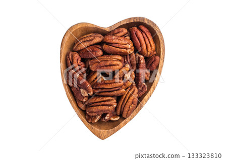 Shelled pecan nuts in a wooden bowl on a clean white background creating a simple natural ingredient shot ideal for culinary and healthy food themes 133323810