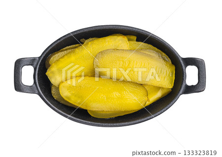 Fresh yellow pickle slices with juicy brined texture on white backdrop, minimal top view food shot for culinary use. Fresh yellow pickle slices with juicy brined texture on white backdrop, minimal top view food shot for culinary use. 133323819