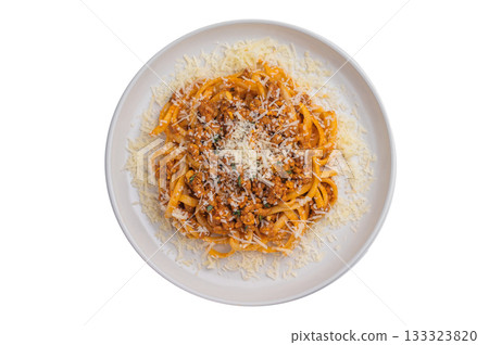 Italian pasta bolognese with rich meat ragu and grated parmesan served on a white plate over clean white background, top view. Italian pasta bolognese with rich meat ragu and grated parmesan served on a white plate over clean white background, top view. 133323820
