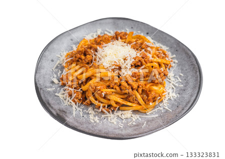 Classic pasta bolognese with rich meat ragu and grated parmesan on a gray plate over white background, hearty Italian dish. 133323831