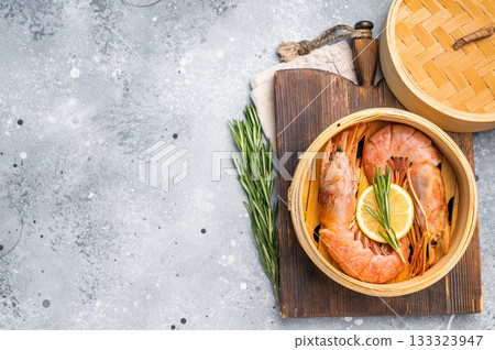 Steamed Red shrimps, Prawns in bamboo steamer. grey background. top view 133323947
