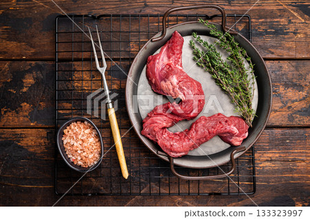 Raw Beef Machete Skirt Steak, fresh marble meat with herbs. wooden background. top view 133323997