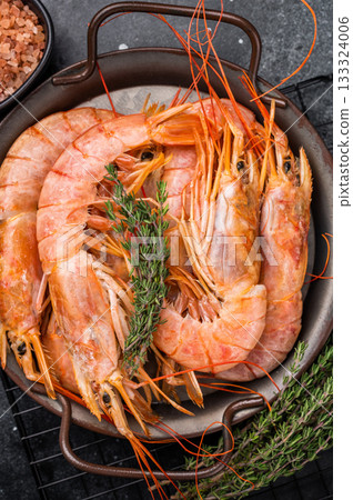 Red Argentine shrimps, raw Prawns Langostino Austral in steel tray. black background. top view Red Argentine shrimps, raw Prawns Langostino Austral in steel tray. black background. top view 133324006