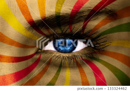 Blue eye on patterned face 133324462