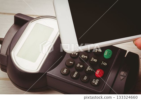 Man using smartphone to express pay 133324660