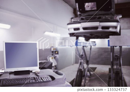 Silver sedan is being lifted on hydraulic lift inside flat design garage with diagnostic cart Silver sedan is being lifted on hydraulic lift inside flat design garage with diagnostic cart 133324737