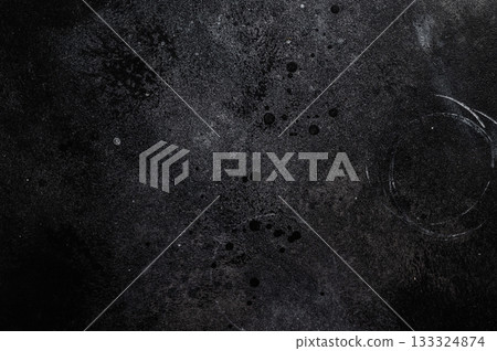 Black cement texture with subtle gray gradients ideal for rustic culinary scenes and stylish tabletop compositions. 133324874