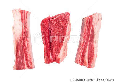 Three raw beef short ribs with fat marbling, isolated on a bright white background. High quality and fresh protein source. Three raw beef short ribs with fat marbling, isolated on a bright white background. High quality and fresh protein source. 133325024