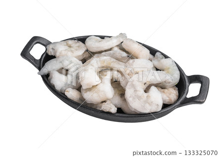 Top view of icy uncooked shellfish (shrimp) in a small black skillet. Protein-rich, healthy ingredient for quick dinner recipes. Top view of icy uncooked shellfish (shrimp) in a small black skillet. Protein-rich, healthy ingredient for quick dinner recipes. 133325070