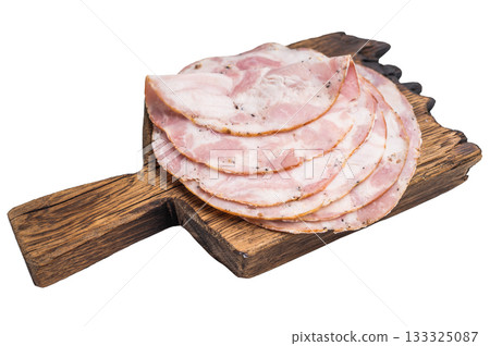 Overhead studio shot of premium deli meat (Pancetta) on a dark wooden plank. Clean white background for easy cutout. 133325087