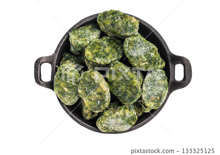 Top view of frozen spinach blocks in a dark cast iron bowl, isolated on a white background. Healthy vegetable ingredient. Top view of frozen spinach blocks in a dark cast iron bowl, isolated on a white background. Healthy vegetable ingredient. 133325125