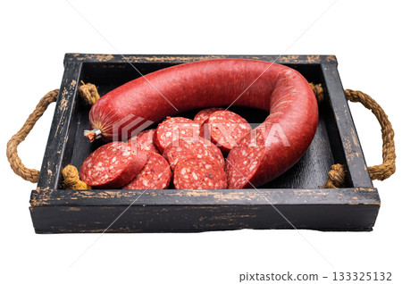 Whole and sliced Turkish sucuk (sujuk) on a rustic cutting board. Traditional spicy dry-cured sausage. Whole and sliced Turkish sucuk (sujuk) on a rustic cutting board. Traditional spicy dry-cured sausage. 133325132